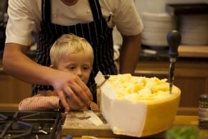 "shaving Grana Padano cheese"