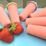 These strawberry colada ice lollies are creamy and cool - just add rum for the adults