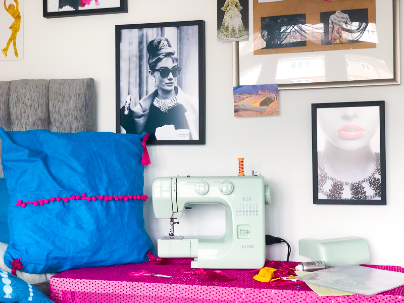 Creating a quick and easy sewing space in a bedroom using framed prints