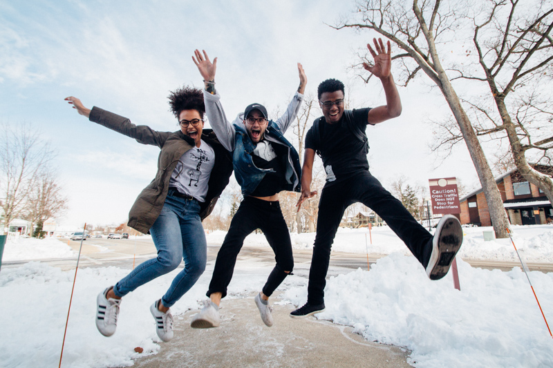 Teenage boys jumping in the air