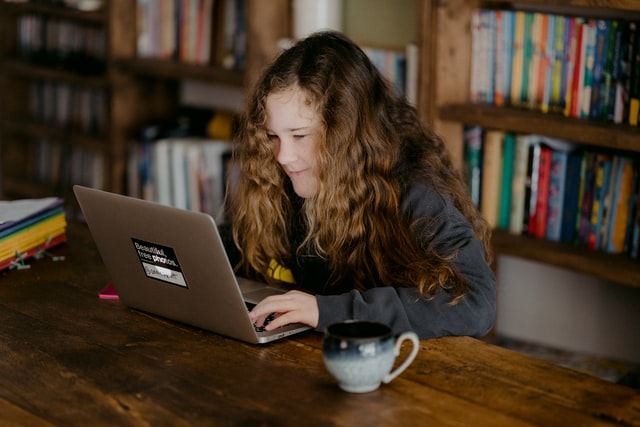 Child learning online at a computer