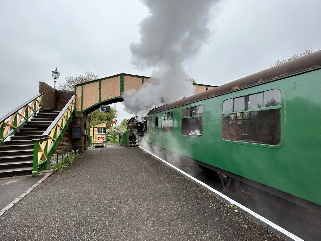 Watercress line steam engine train at Ropley opposite Watercress Lodges